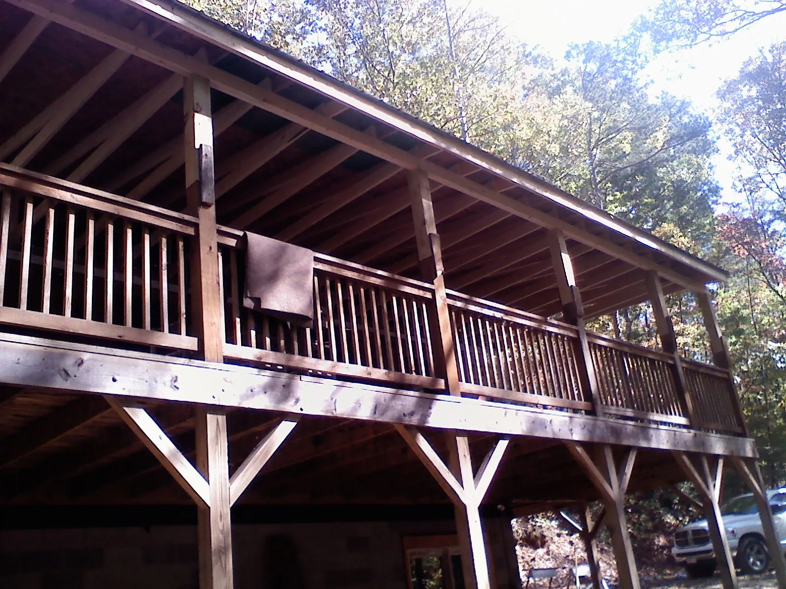 Timber framing under a new elevated porch and deck — Roof Leak Repair in Platte City by Roofing Brothers